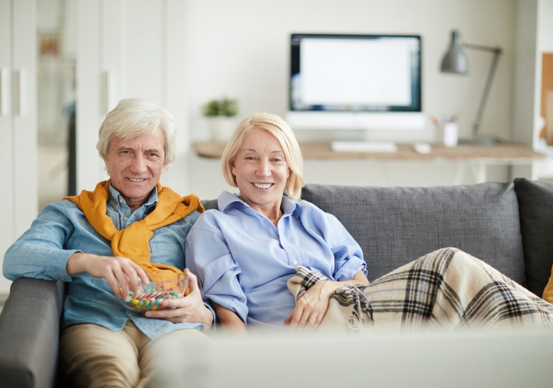 modern-senior-couple-watching-tv.jpg